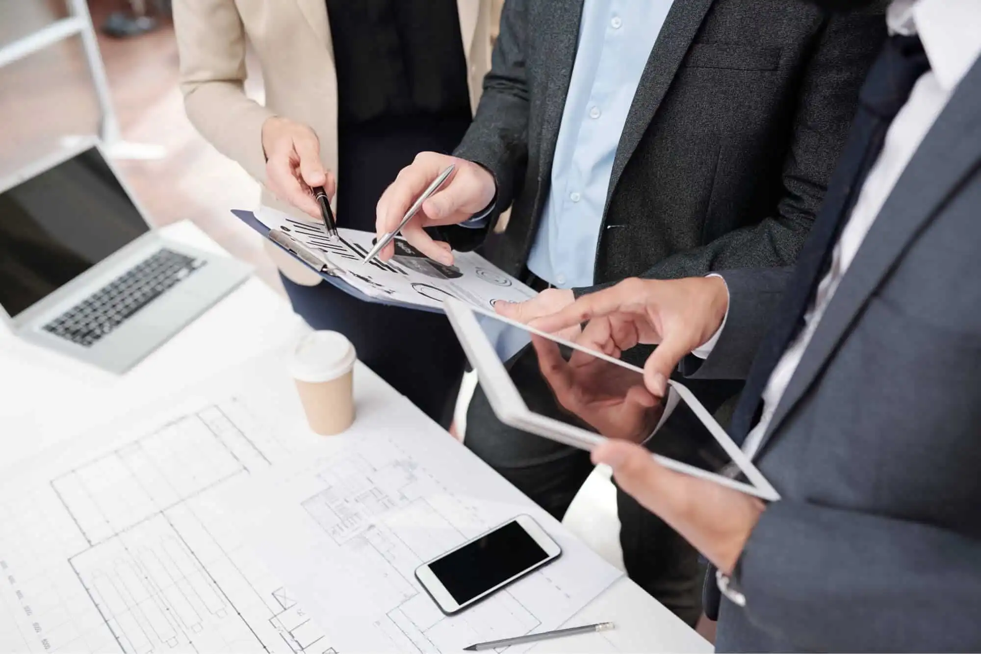 Business team reviewing plans at a desk
