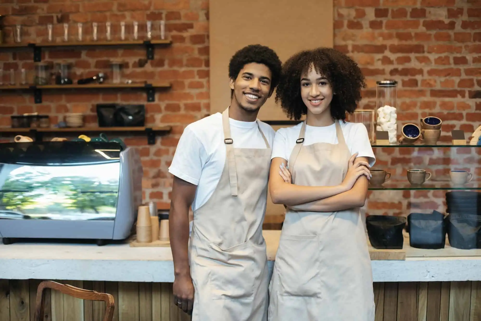 Small business owners standing in their shop